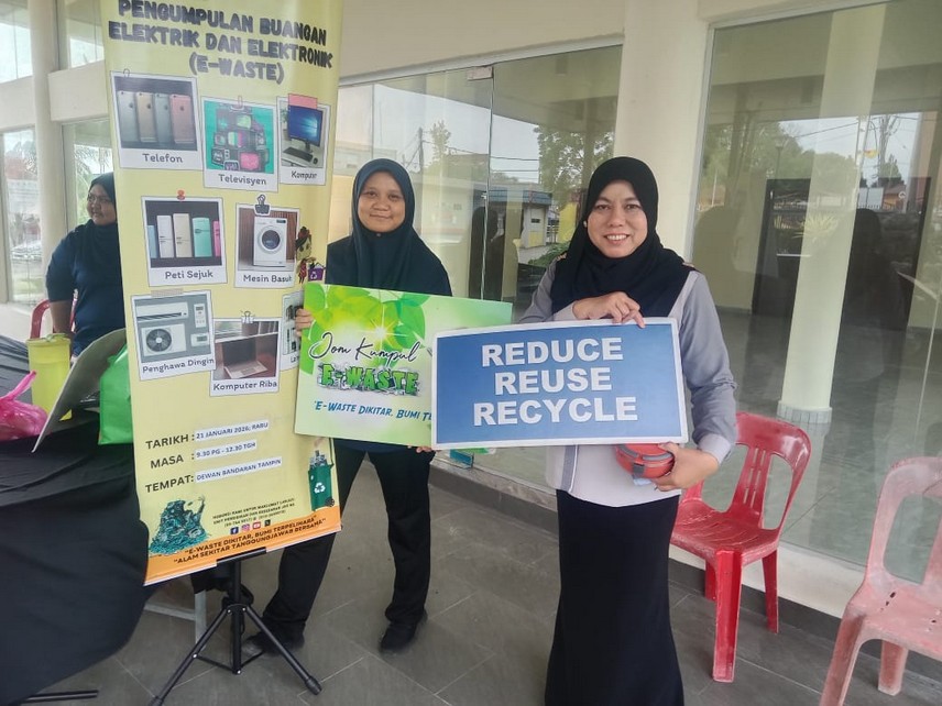 E-waste collection banner and volunteers