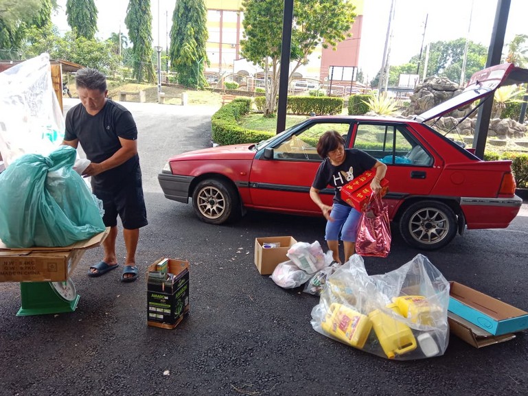 SWCorp Trash to Cash crew with programme banner at Dewan Bandaran